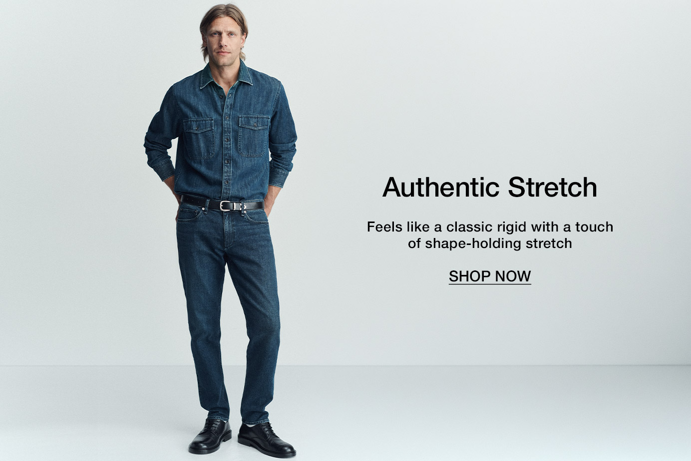 Authentic Stretch. Feels like a classic rigid with a touch of shape-holding stretch